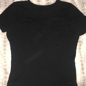 A black short sleeve shirt with slit